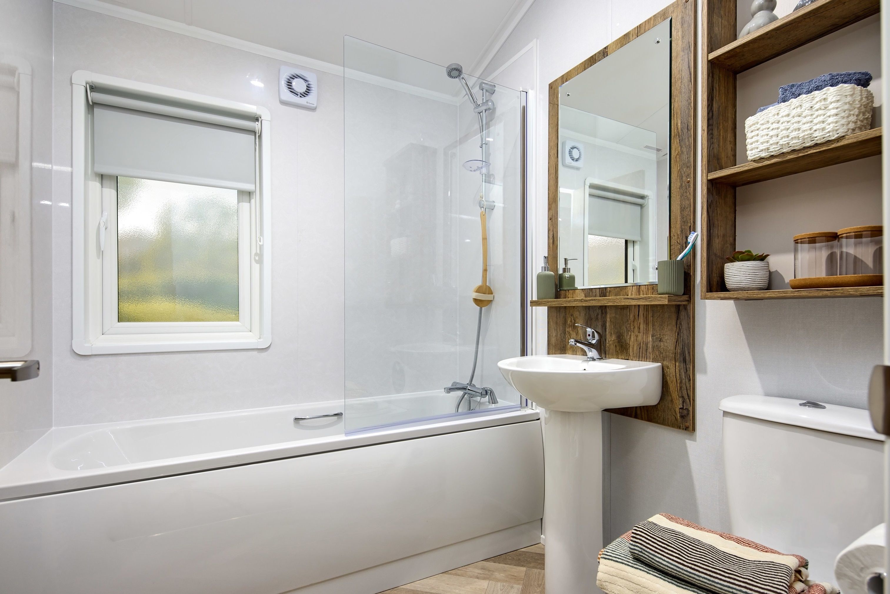 The Willerby Boston bathroom with dark oak effect units and an optional bathtub.