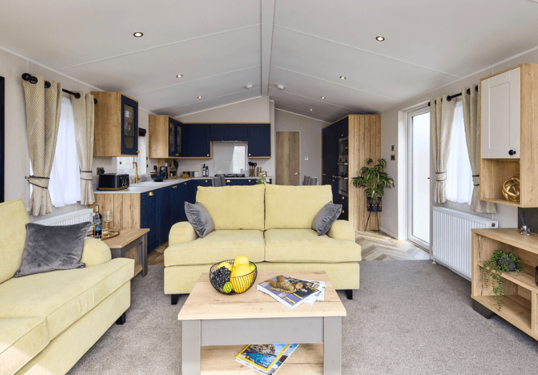Gainsborough lounge with yellow sofas and oak units.