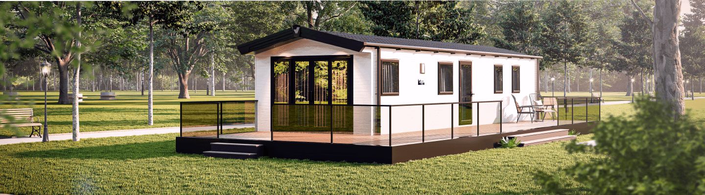 The Willerby Manor exterior in white with an oak decking, sited on a field.