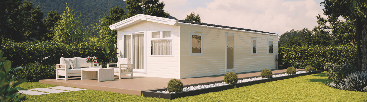 The Willerby Rio exterior in light cream sited on a secluded grassy field.