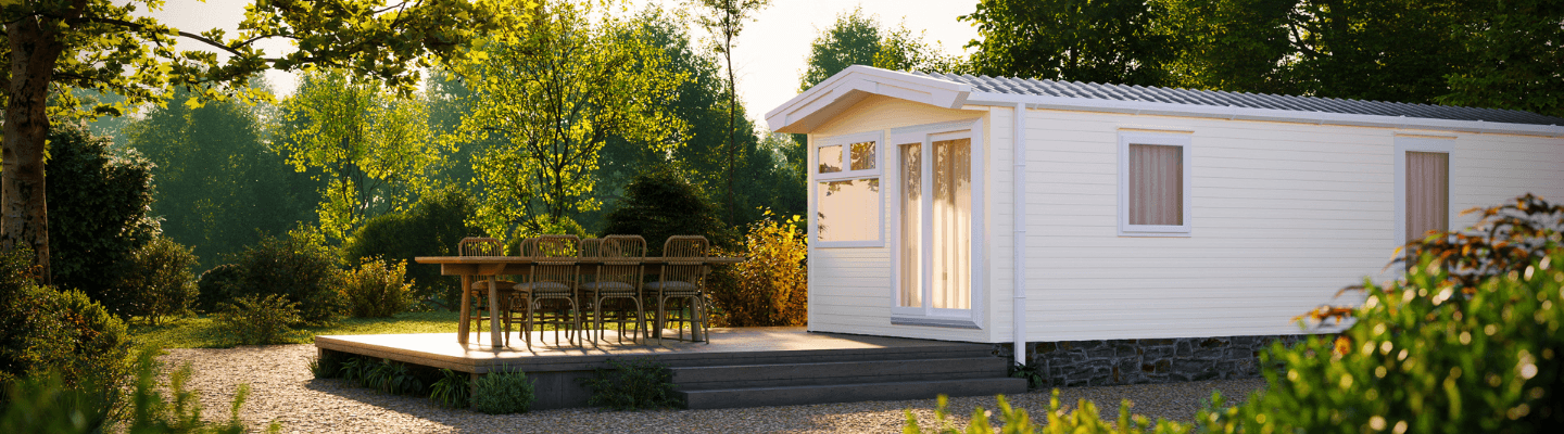 The Willerby Rio Compact exterior in light cream sited on a secluded stone area.