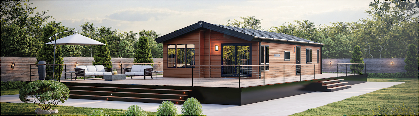 The Willerby Pinehurst exterior in brown on a brown decking, sited in a secluded and quiet area.