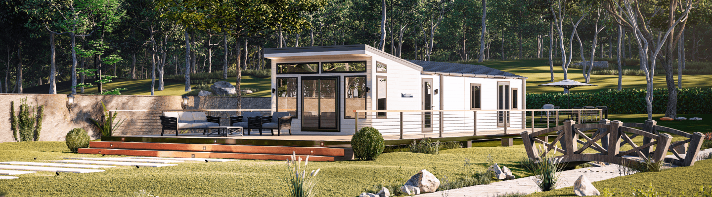 The Willerby Vogue Classique with a white exterior, sited on a secluded grassy field.