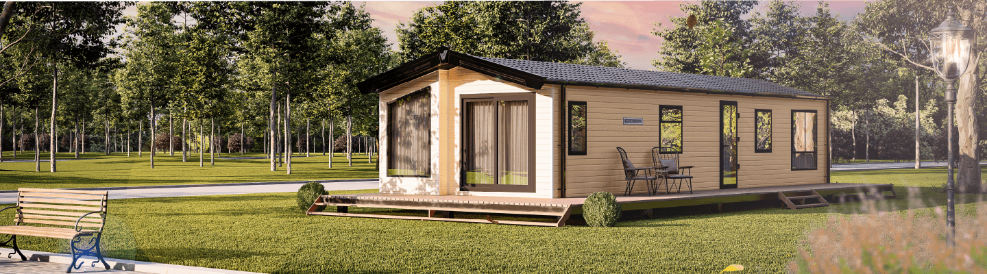 The Willerby Waverley exterior in a light yellow sited on a grassy field.