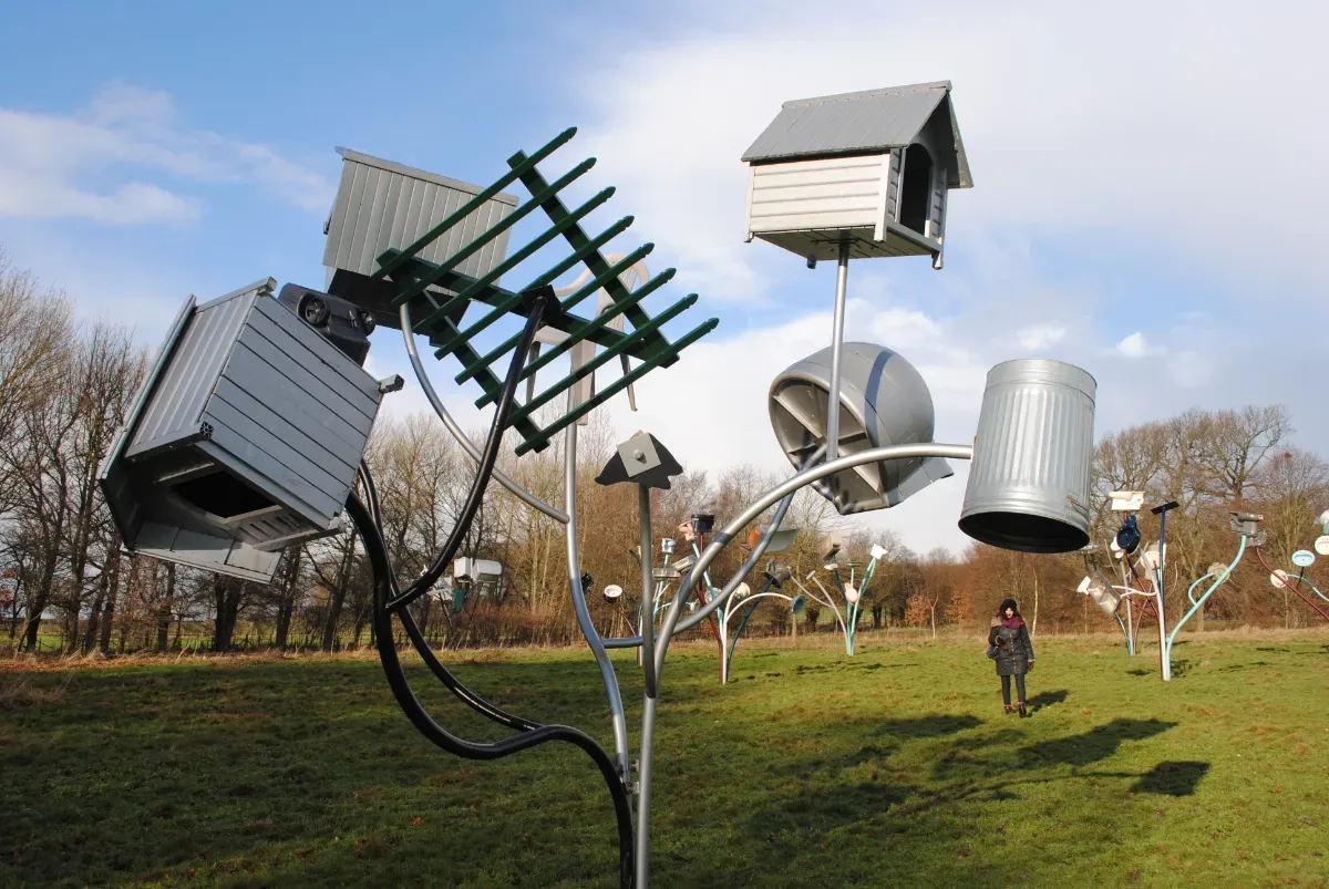 Metal sculpture of dog kennels, bins and fencing outdoors at the Yorkshire Sculpture Park
