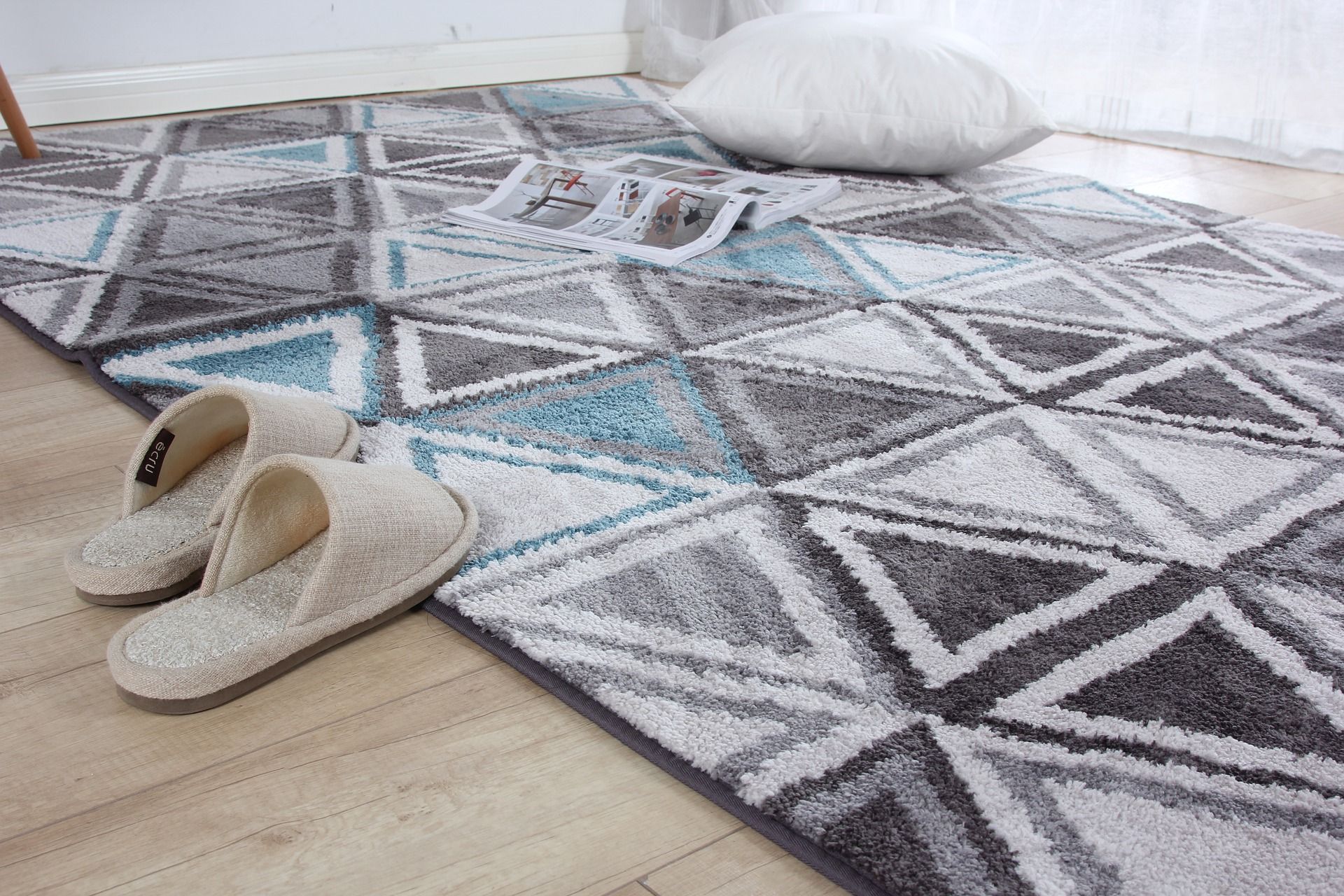 Comfy looking slippers on warm, soft patterned rug on static caravan floor