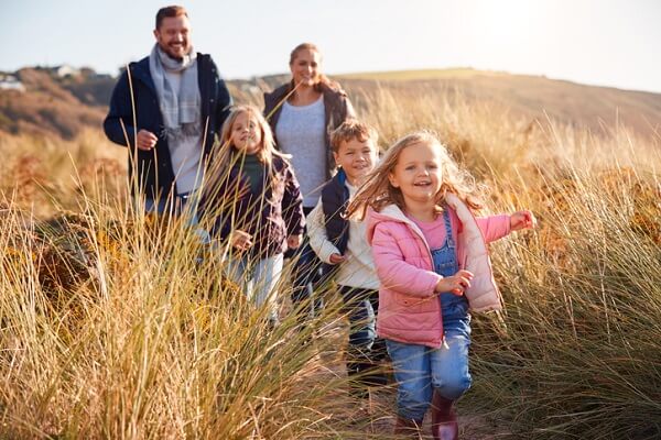 family walking through grass.jpg