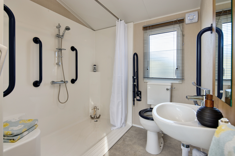 The Willerby Richmond bathroom has an accessible shower pod with plenty of grab rails.